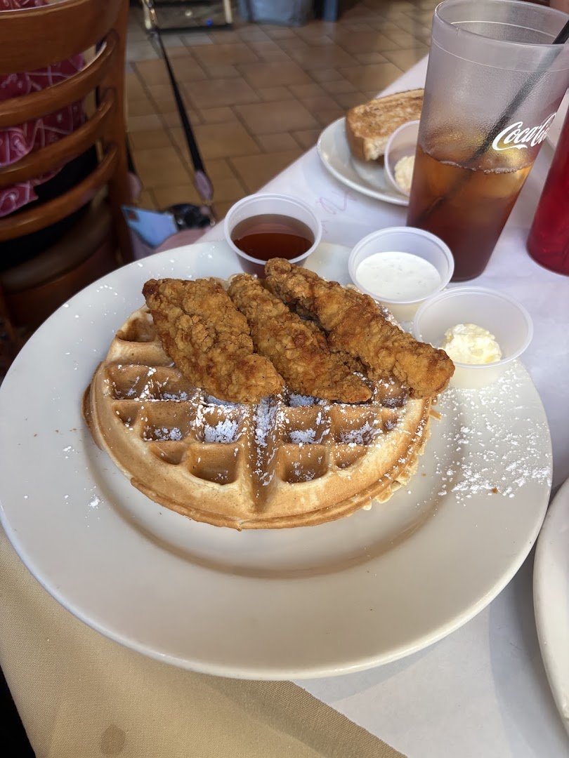 American breakfast dishes arranged on simple white plates.