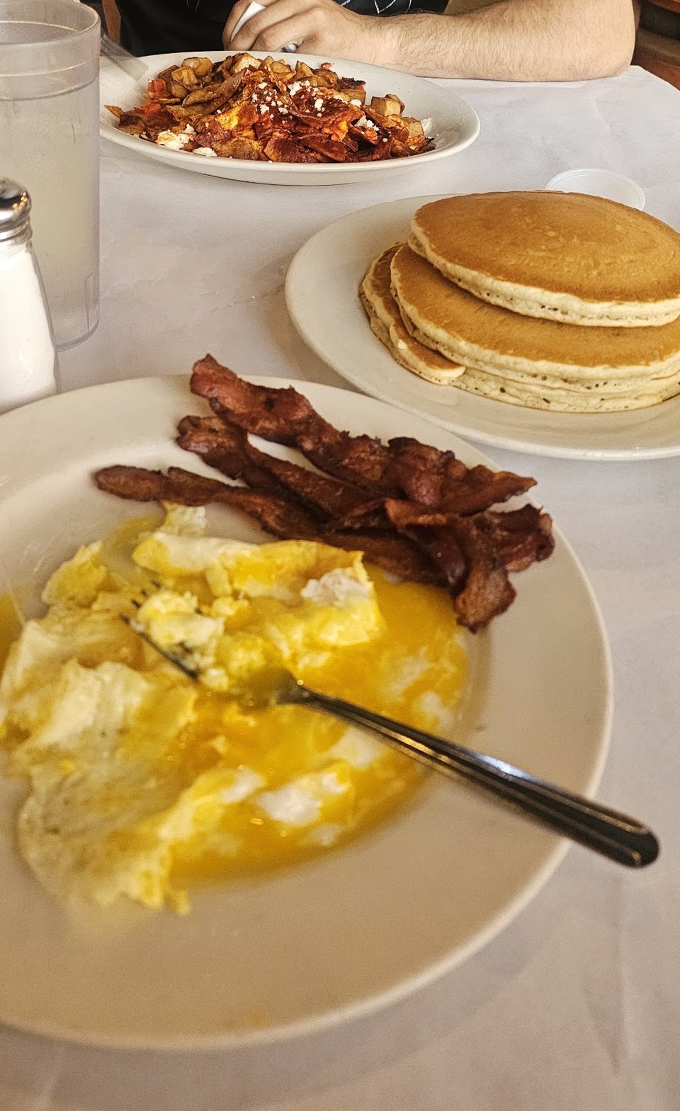 Printed breakfast menu with griddle and sandwich sections.
