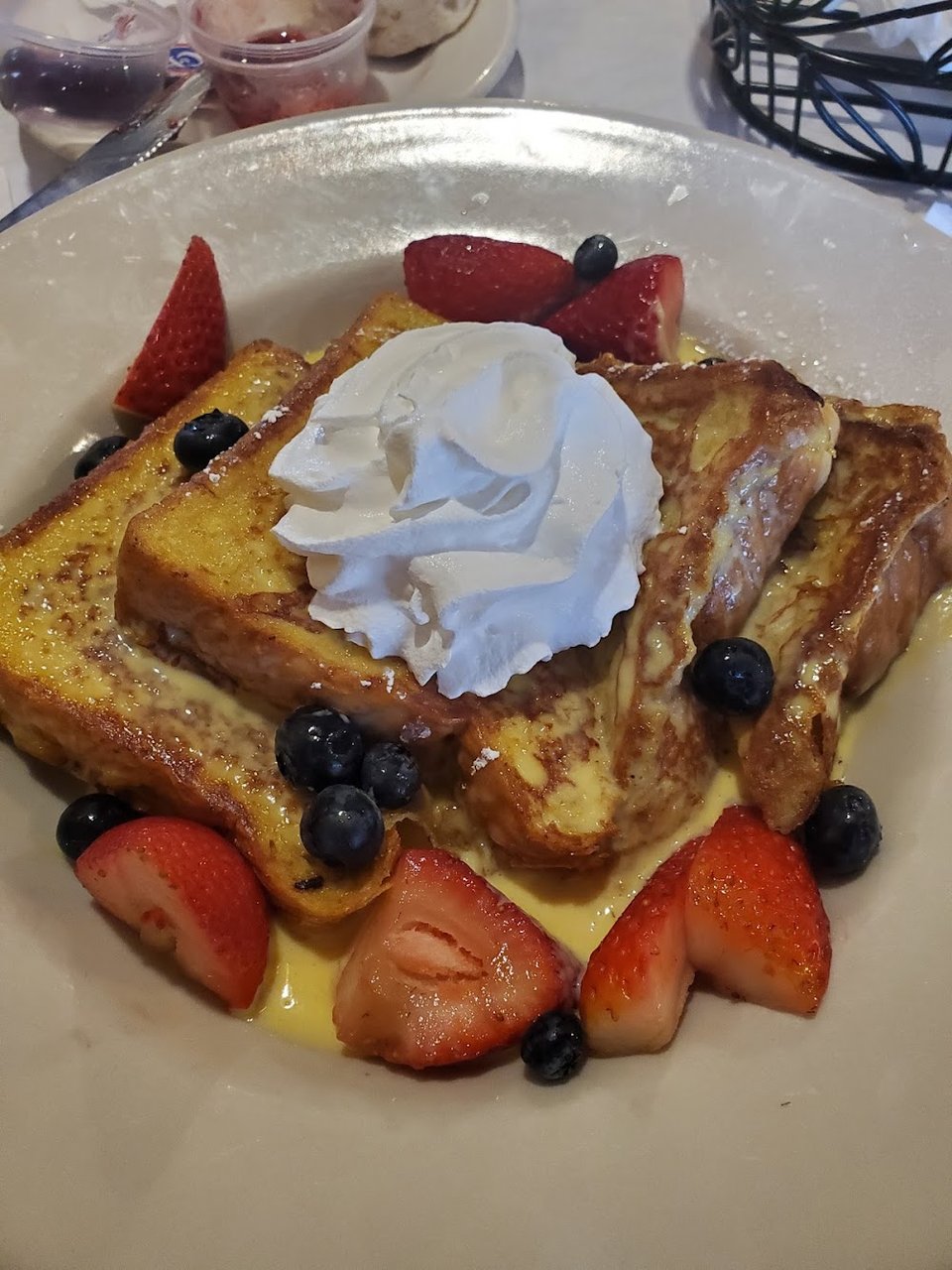 Printed breakfast menu with griddle and sandwich sections.