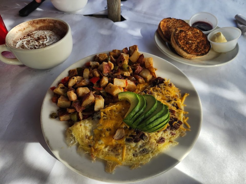 Breakfast menu layout with specialty dishes and coffee.